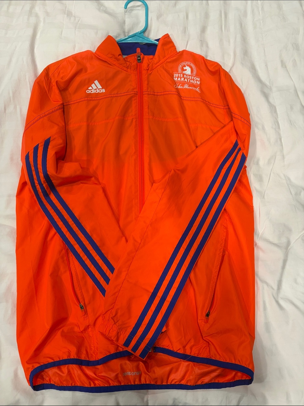 adidas Men’s Bright Orange Windbreaker with Blue Stripe Accents